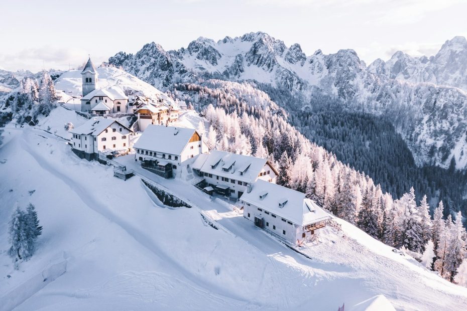 A snowy mountain village surrounded by peaks